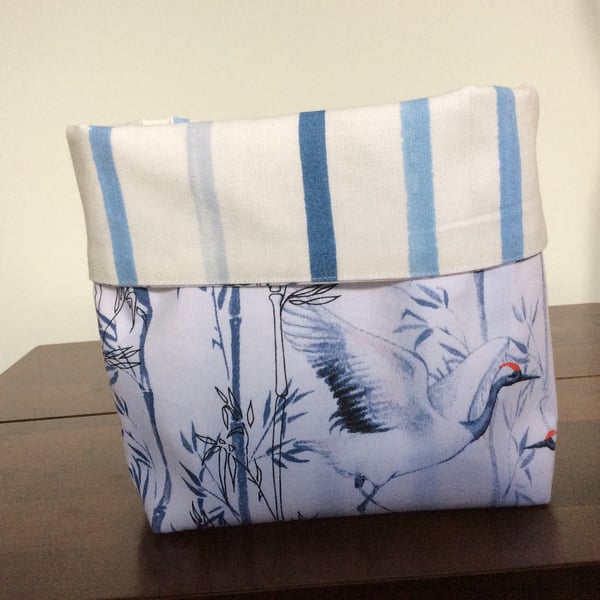Reversible fabric basket in Painterly Stripe Blue fabric and Crane cotton fabric