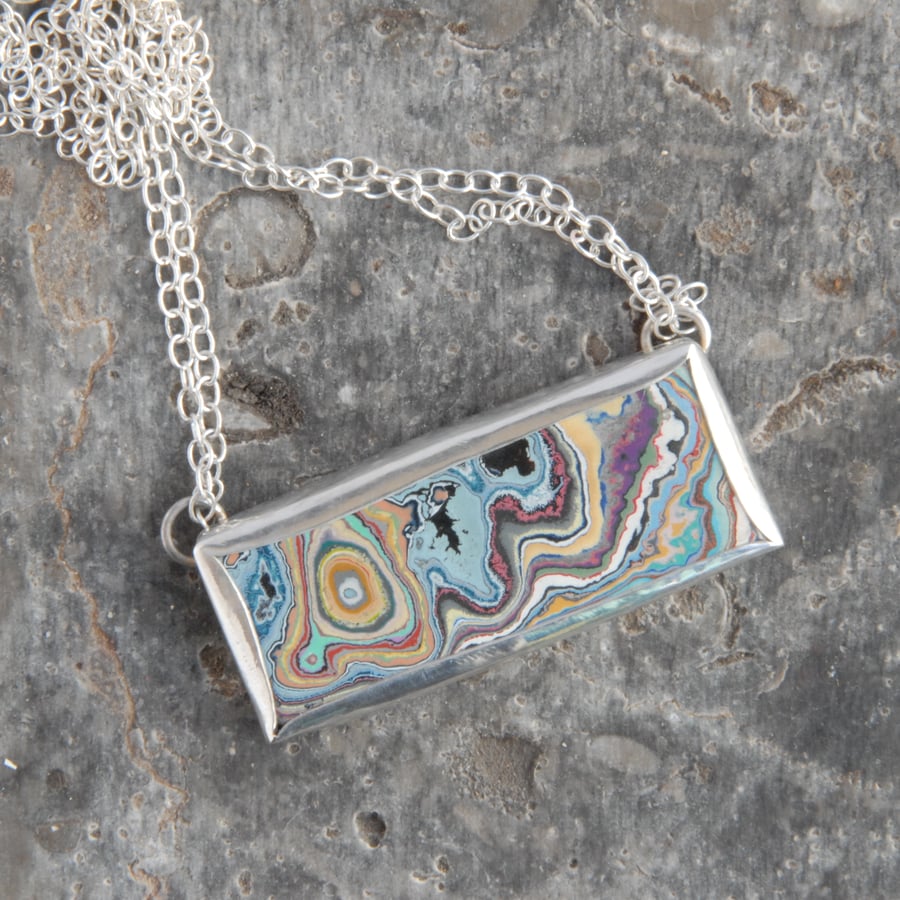 Blue and peach graffitite pendant