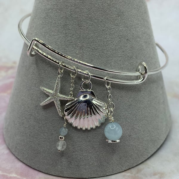 Silver plated charm bangle with aquamarine and topaz stones