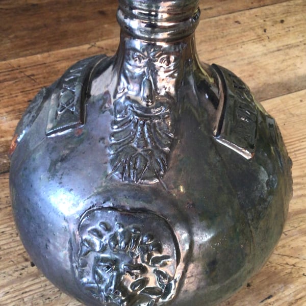 Green Earthenware Bellarmine with 2020 date stamp in Roman numerals.