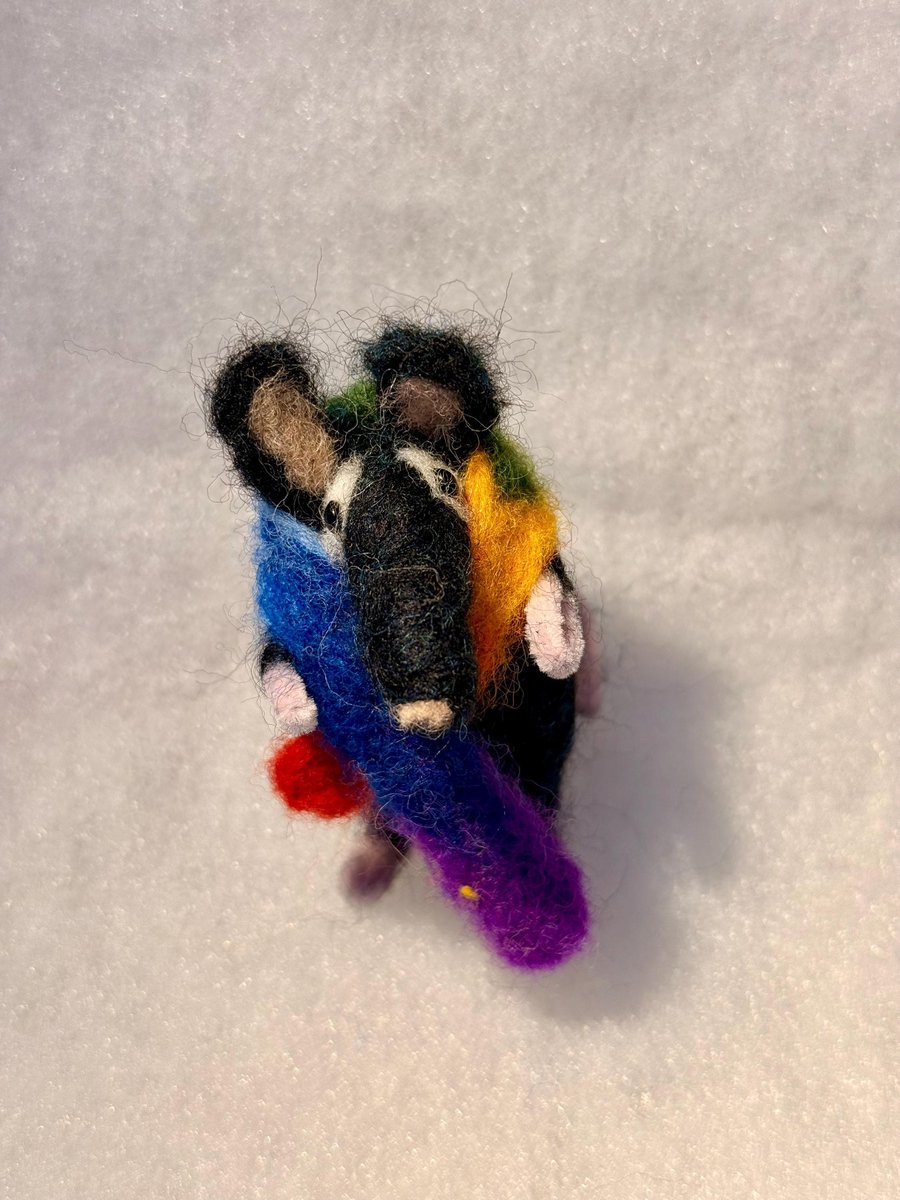 Felted mouse - black with white eye patches keeping warm with rainbow scarf
