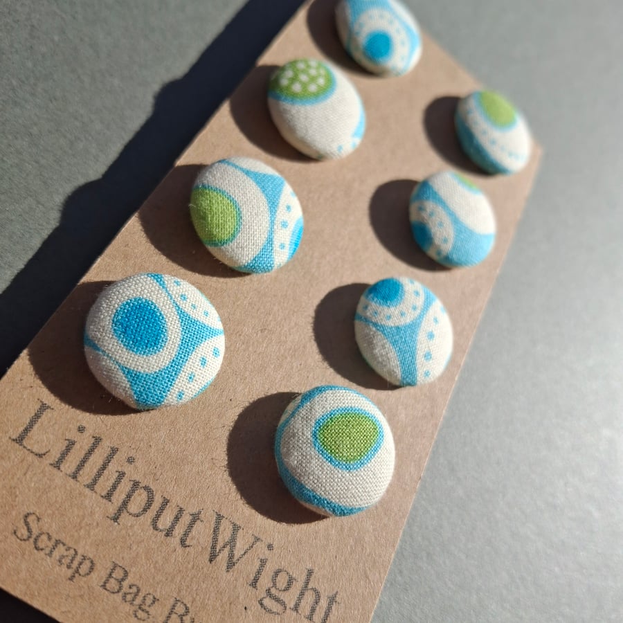 Set of eight scrap bag buttons - in shades of blue, green and cream