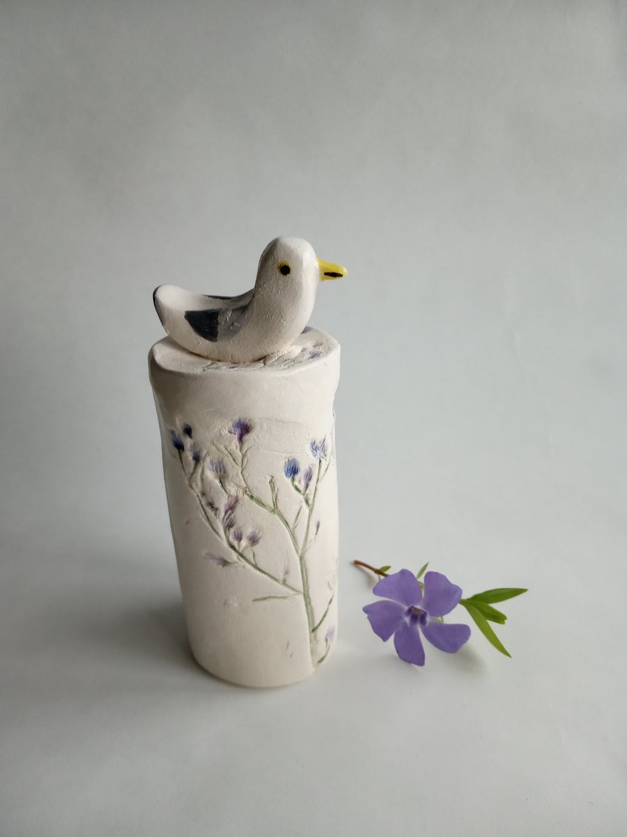 Ceramic seagull on floral plinth