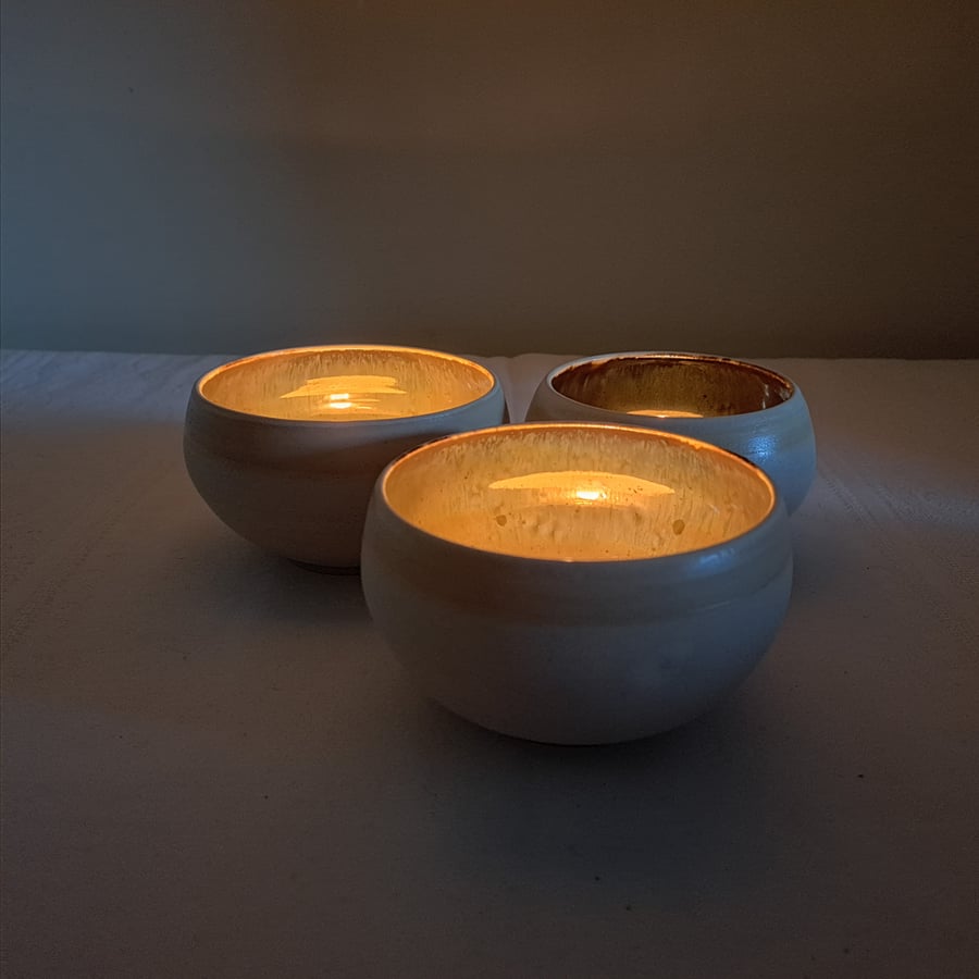 HAND MADE TEA LIGHT HOLDER  glazed in reflective mirror glaze and white