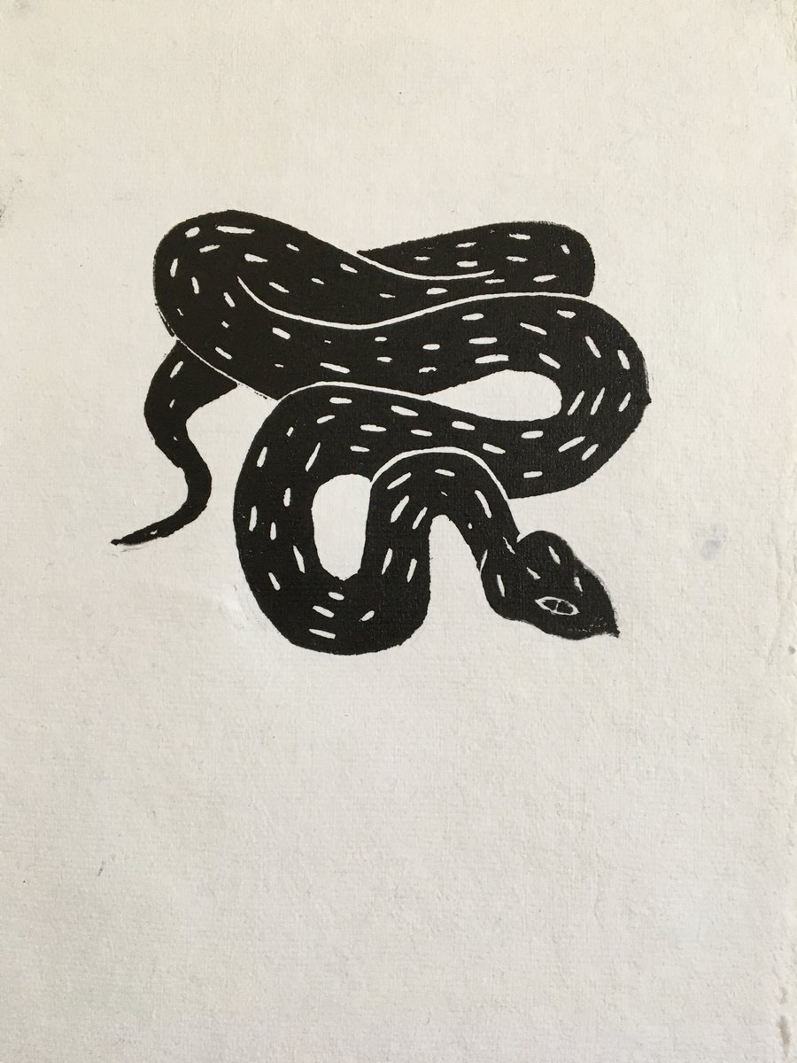 Adder, linocut print of a black snake on handmade paper.