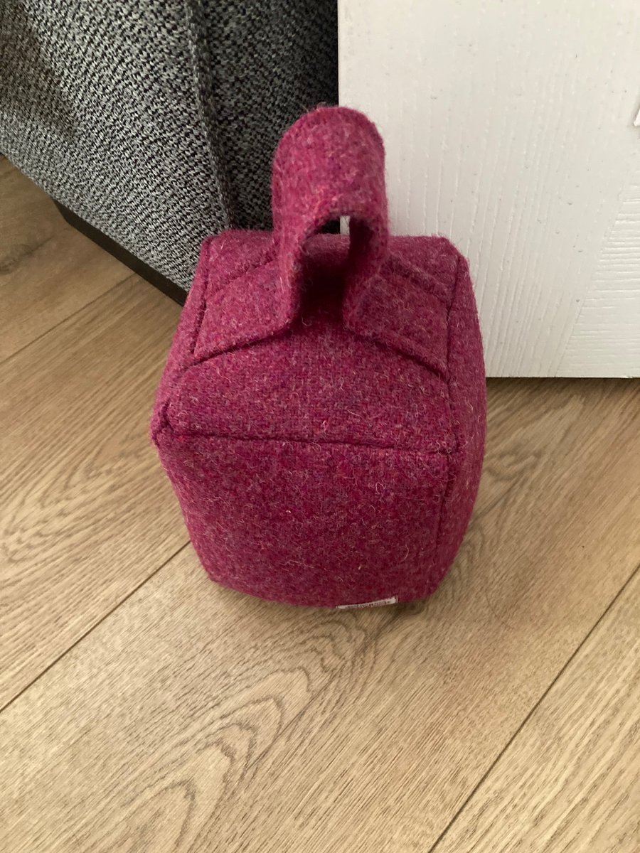 A Raspberry Pink Harris Tweed Doorstop