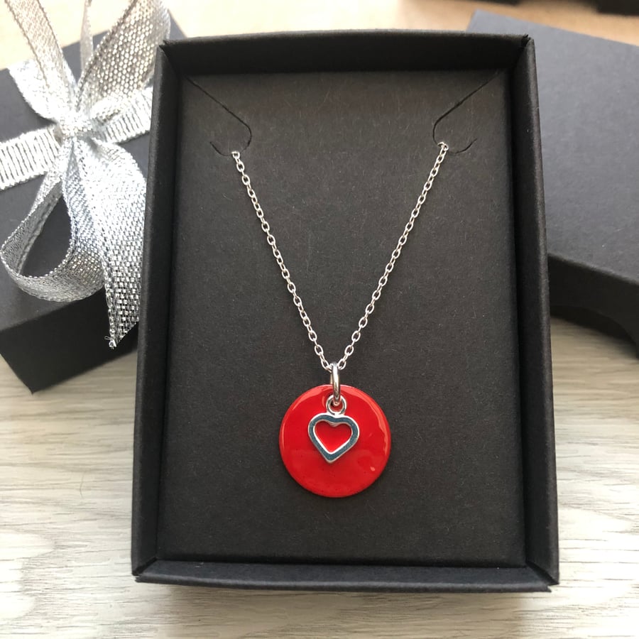 Red enamel disc and sterling silver heart. Sterling silver necklace.