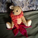 Ted, a collectable jointed bear, an Autumnal silk leaf and a big woolly scarf