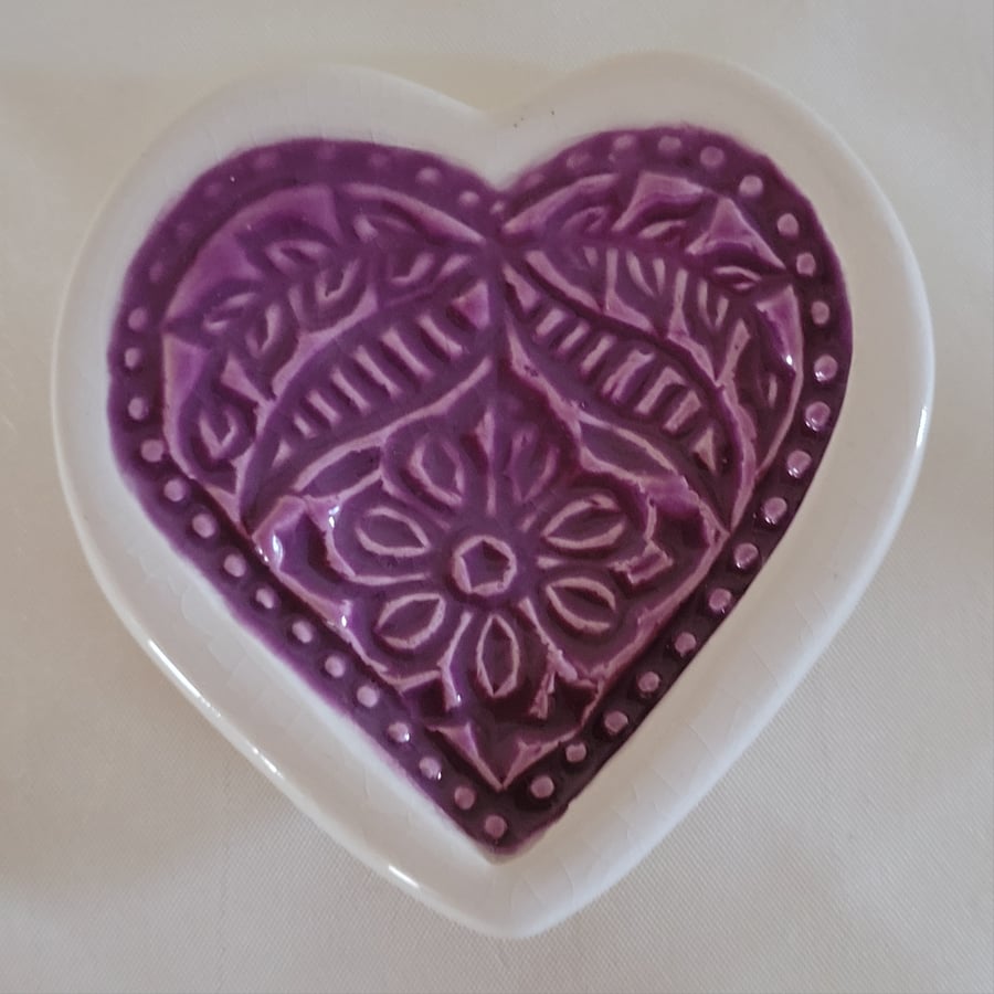 Embossed heart ring dish.