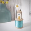 Wooden House on a Vintage Bobbin with a Clay Daisy