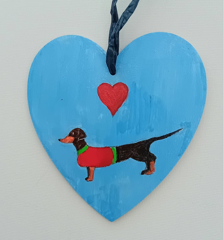 Dinky little  dachshund on a heart shape 
