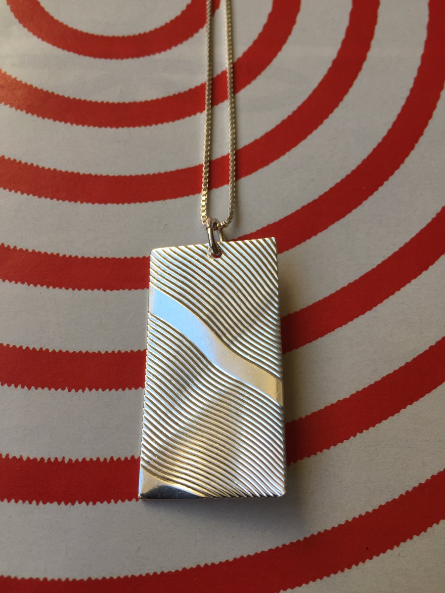 Silver sunbeam necklace