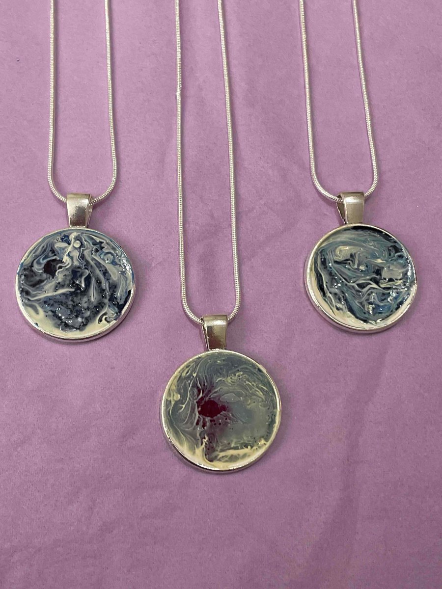 Small world pendant on silver snake chain pink