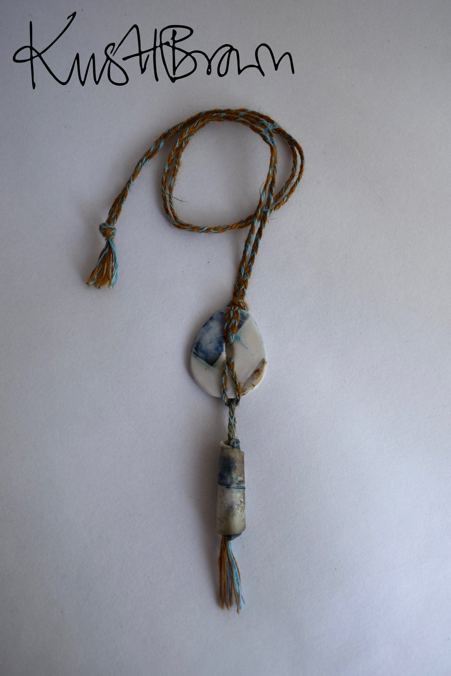 Porcelain Pebble Pendant with Bead and Linen Thread