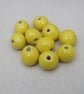 10 Small Lemon Yellow Glazed Clay Beads - Image 1