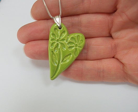 Ceramic green pendant necklace imprinted with a floral design - sterling silver