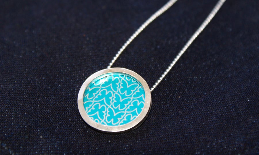 Silver and turquoise circle necklace - butterfly pattern