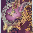 Dramatic burgundy butterfly with love card