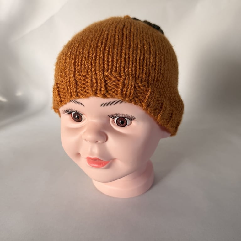 Children's Hand Knitted Hat with Leaf Detail