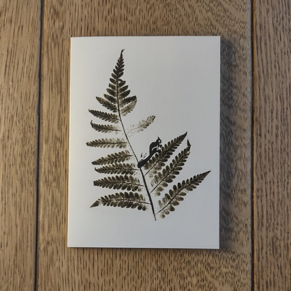 Squirrel. Image made on a printing press and hand made stamps.