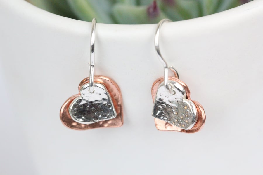 Silver and copper textured two heart drop earrings