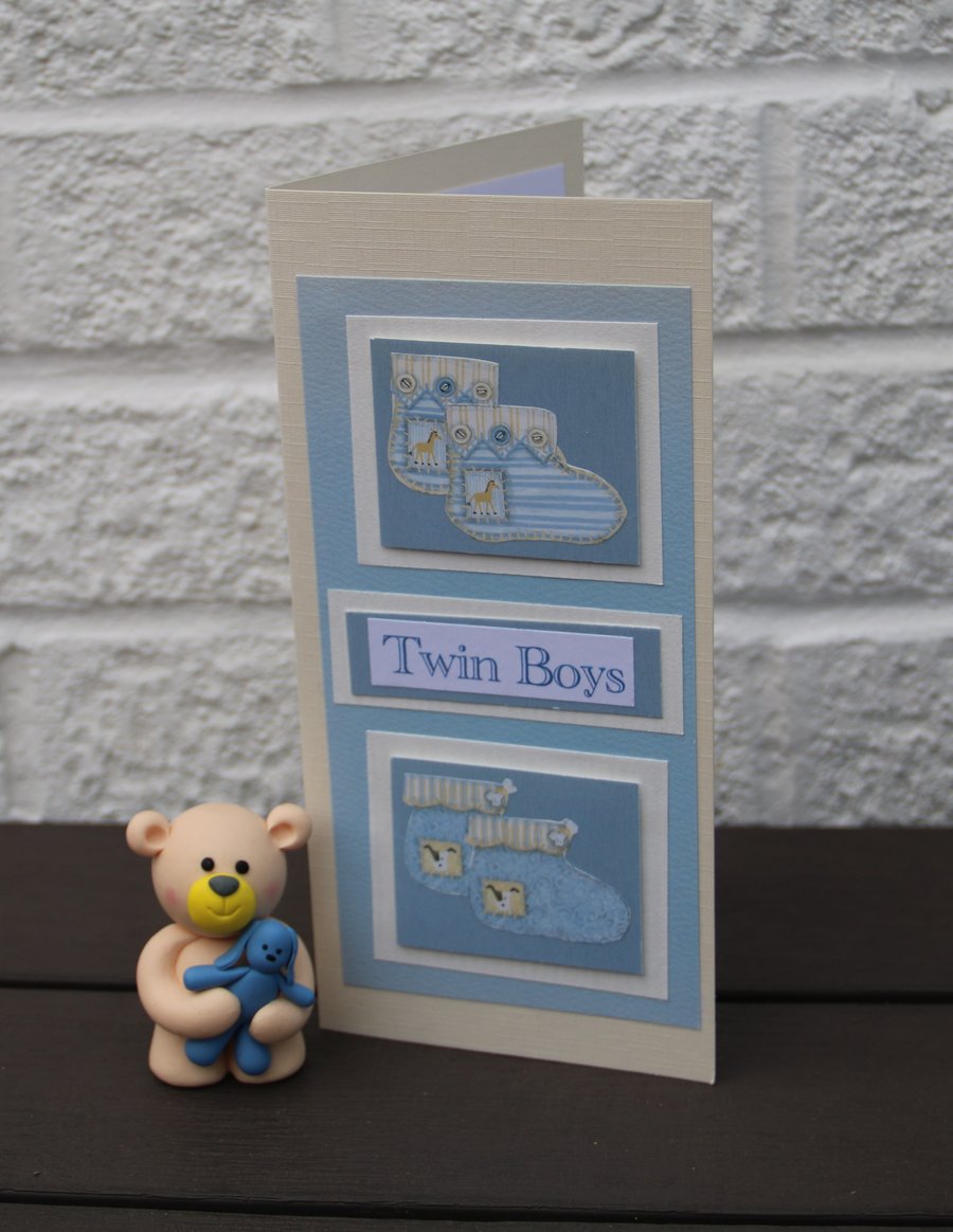 Twin baby boys card, two sets of Baby bootees mounted on 8x4" (DL) card 