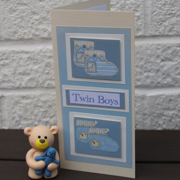 Twin baby boys card, two sets of Baby bootees mounted on 8x4" (DL) card 