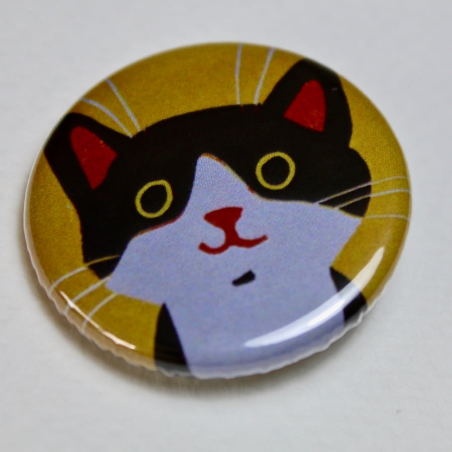 LITTLE BLACK AND WHITE CAT ON YELLOW BADGE