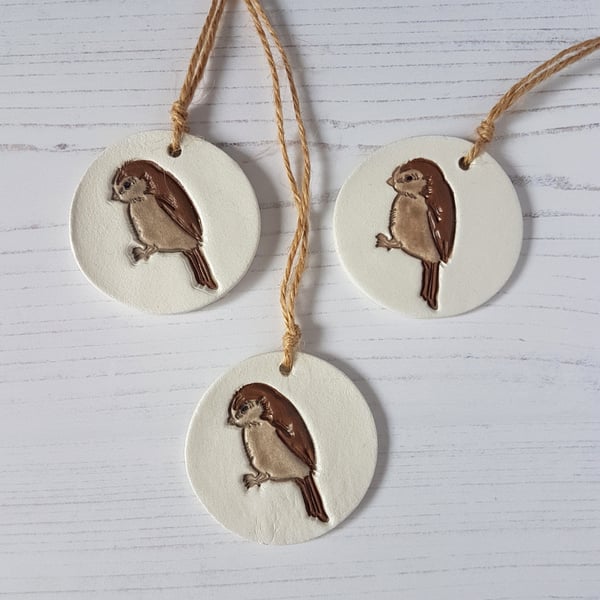 Brown bird hanging decoration, one supplied