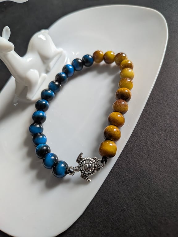 Blue and yellow bracelet with turtle