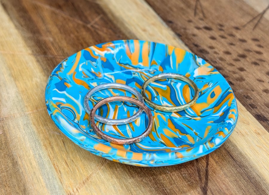 Vibrant turquoise and orange swirly trinket dish