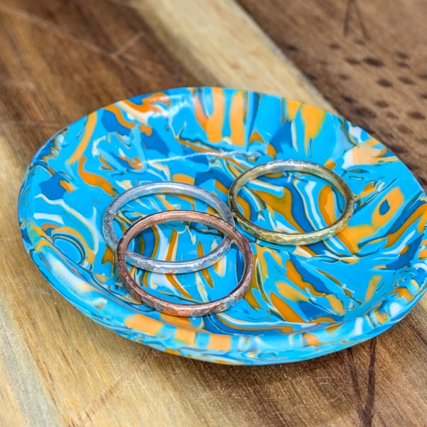 Vibrant turquoise and orange swirly trinket dish