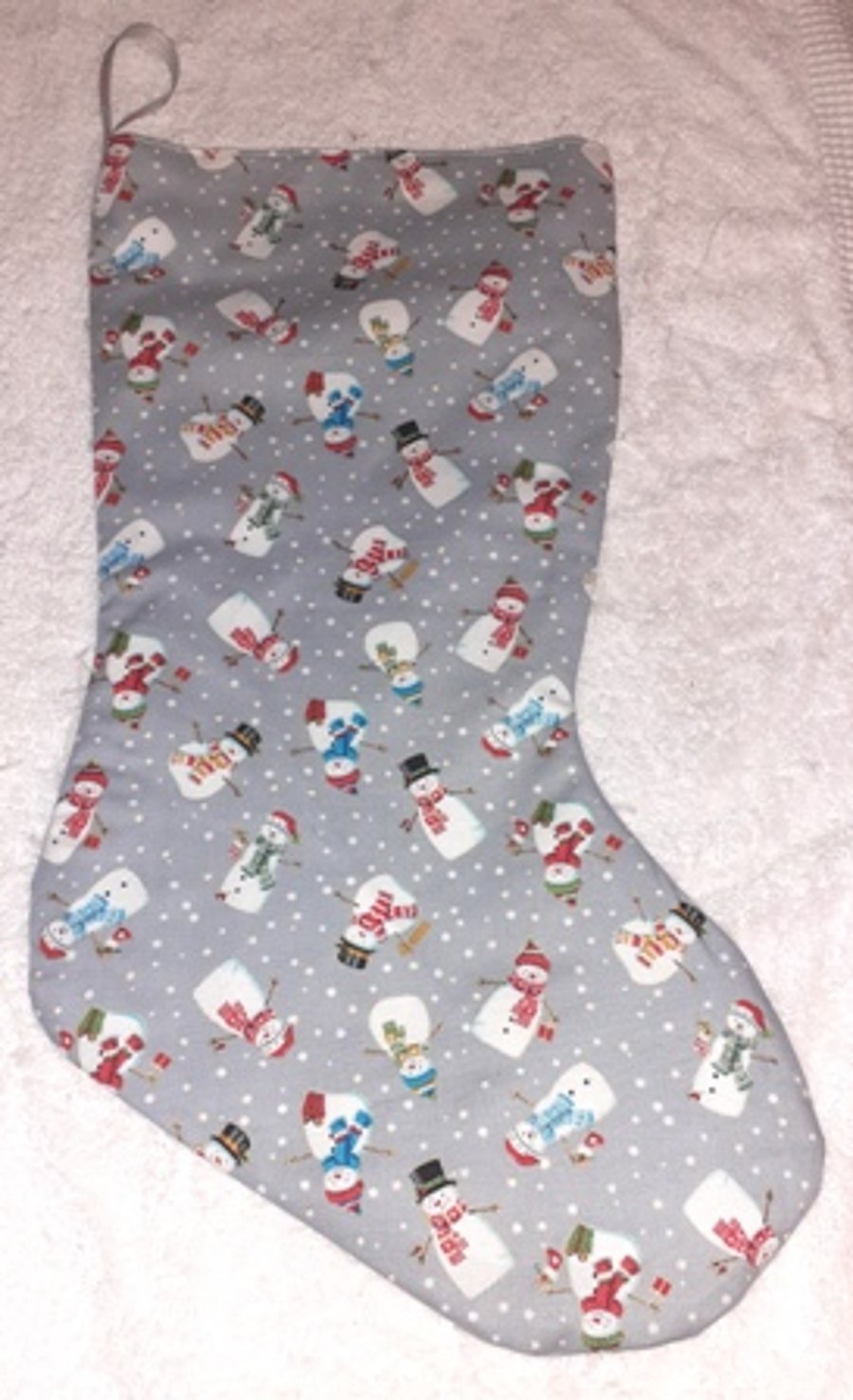 Colourful snowmen on silver grey Christmas stocking