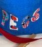 Blue peg bag with red shoulder strap.  - Image 3