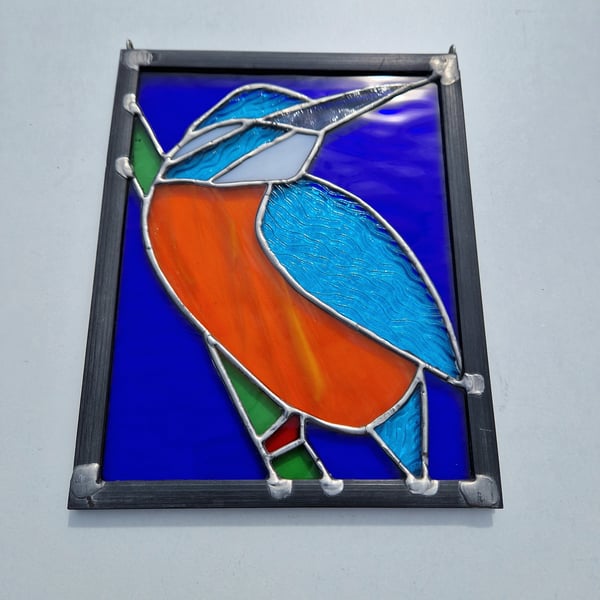Stained glass kingfisher bird panel.