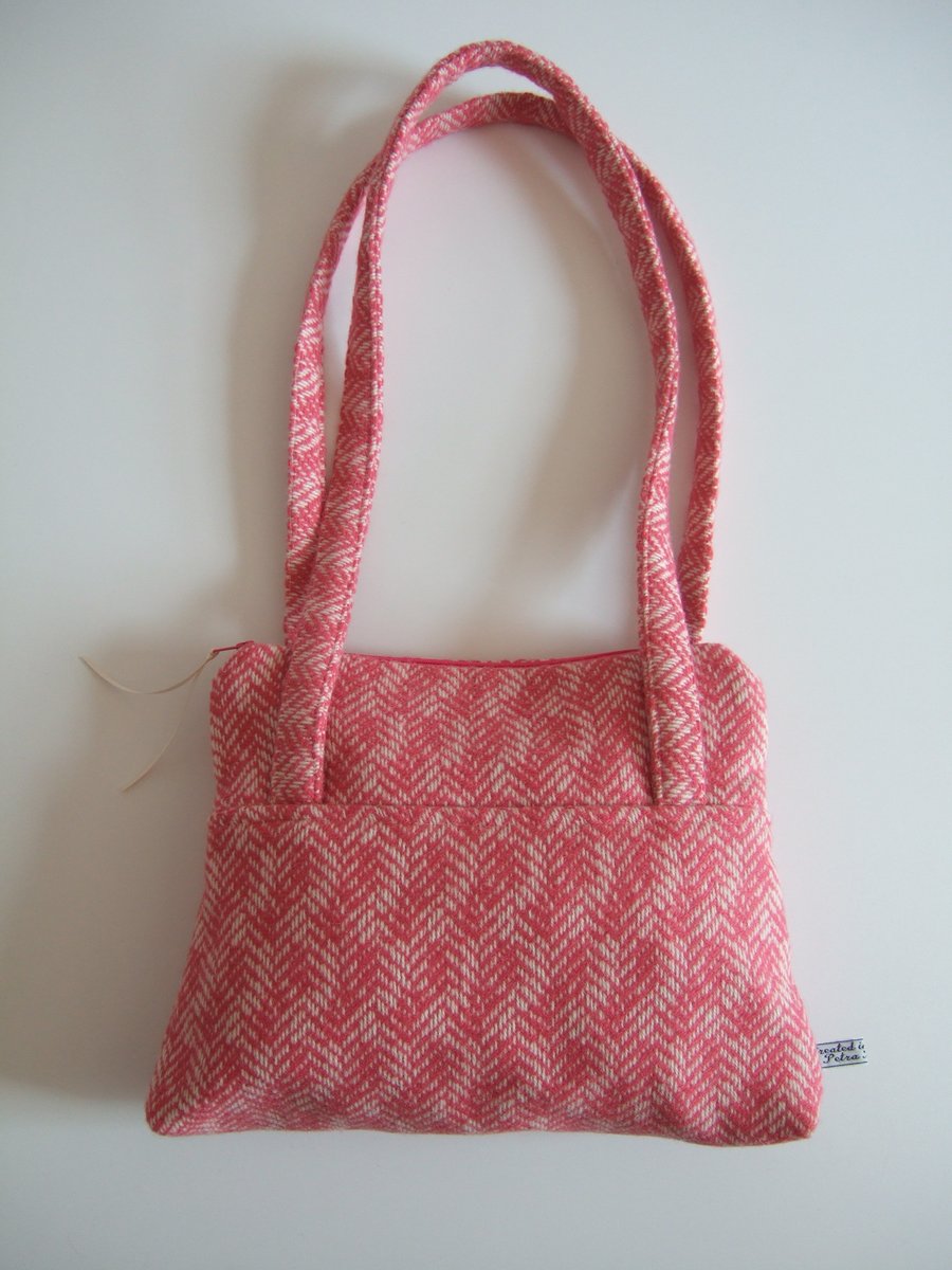 Petite pink herringbone woollen shoulder bag with zip.