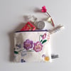 Make up bag upcycled from vintage embroidery pansies table linen.