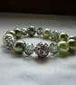 SHADES OF GREENS AND SILVER  BRACELET.  811 - Image 1