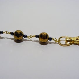 Gold and Black Hematite Bag Charm.