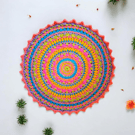 Large, bright crochet mandala doily table mat