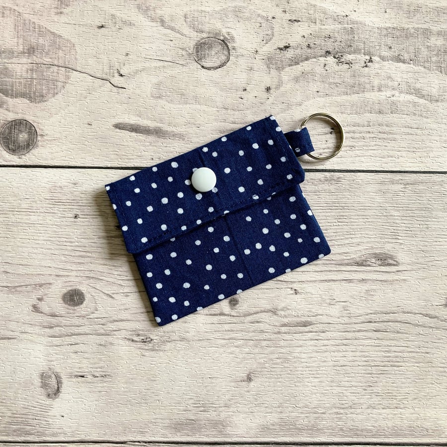 Lip balm keyring. Blue and white polka dot themed cotton fabric.