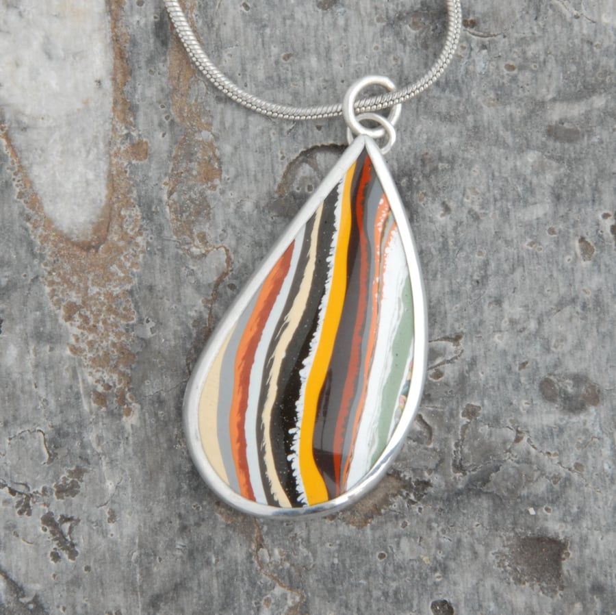 Retro boatite and silver pendant