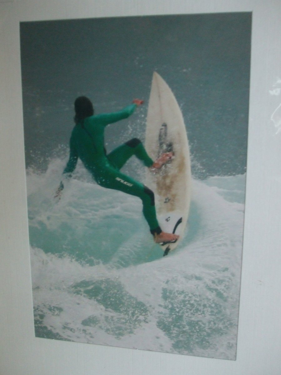 Photographic greetings card of a surfer about to 'Wipeout'.