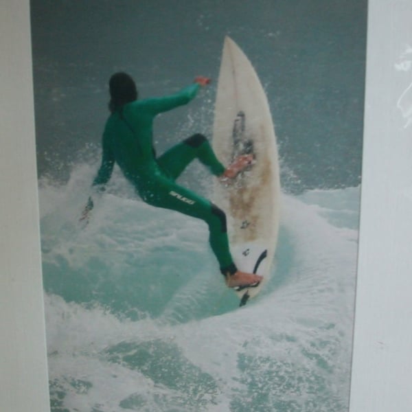 Photographic greetings card of a surfer about to 'Wipeout'.