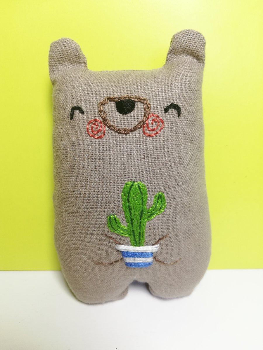Bear Holding a Cactus