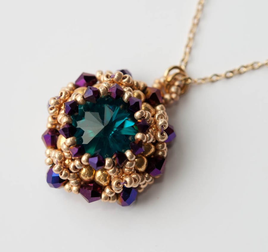 Turquoise, gold and aubergine crystal pendant necklace