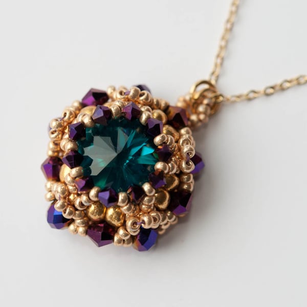 Turquoise, gold and aubergine crystal pendant necklace