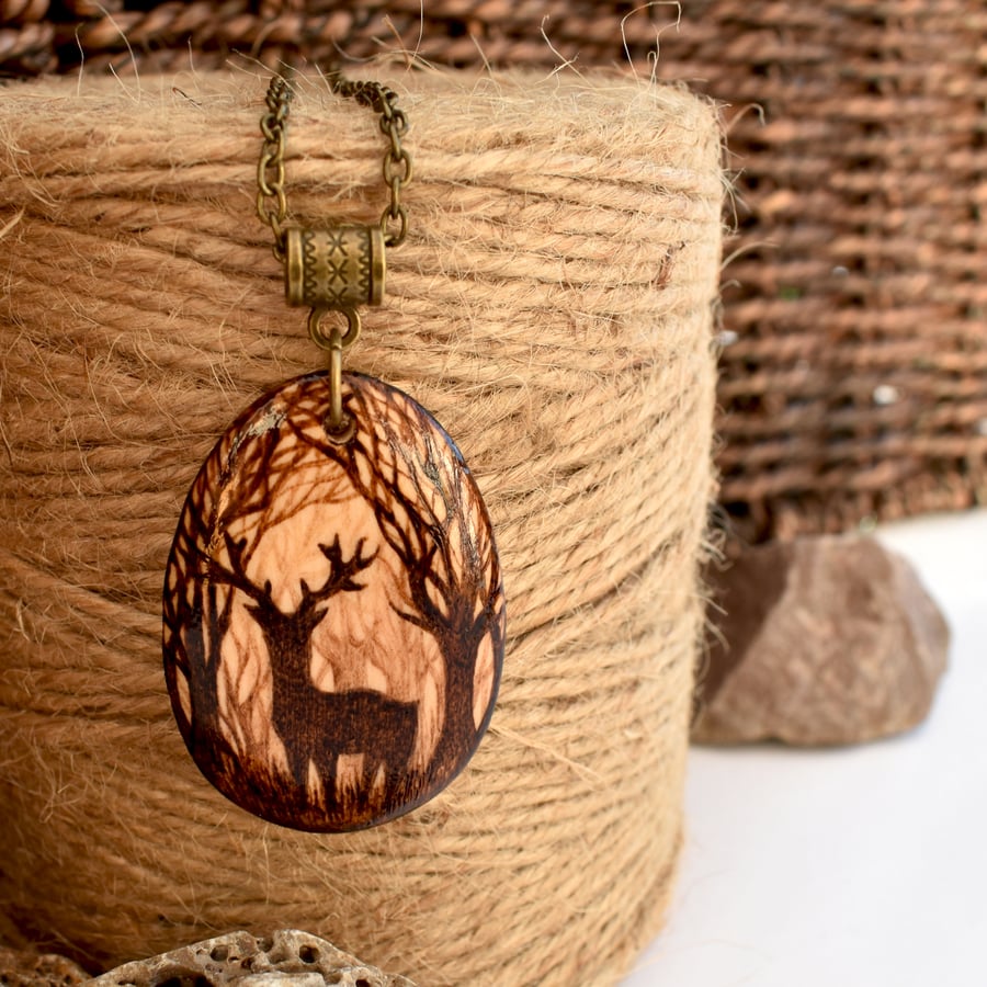 Majestic lone stag at twilight, pyrography silhouette pendant necklace