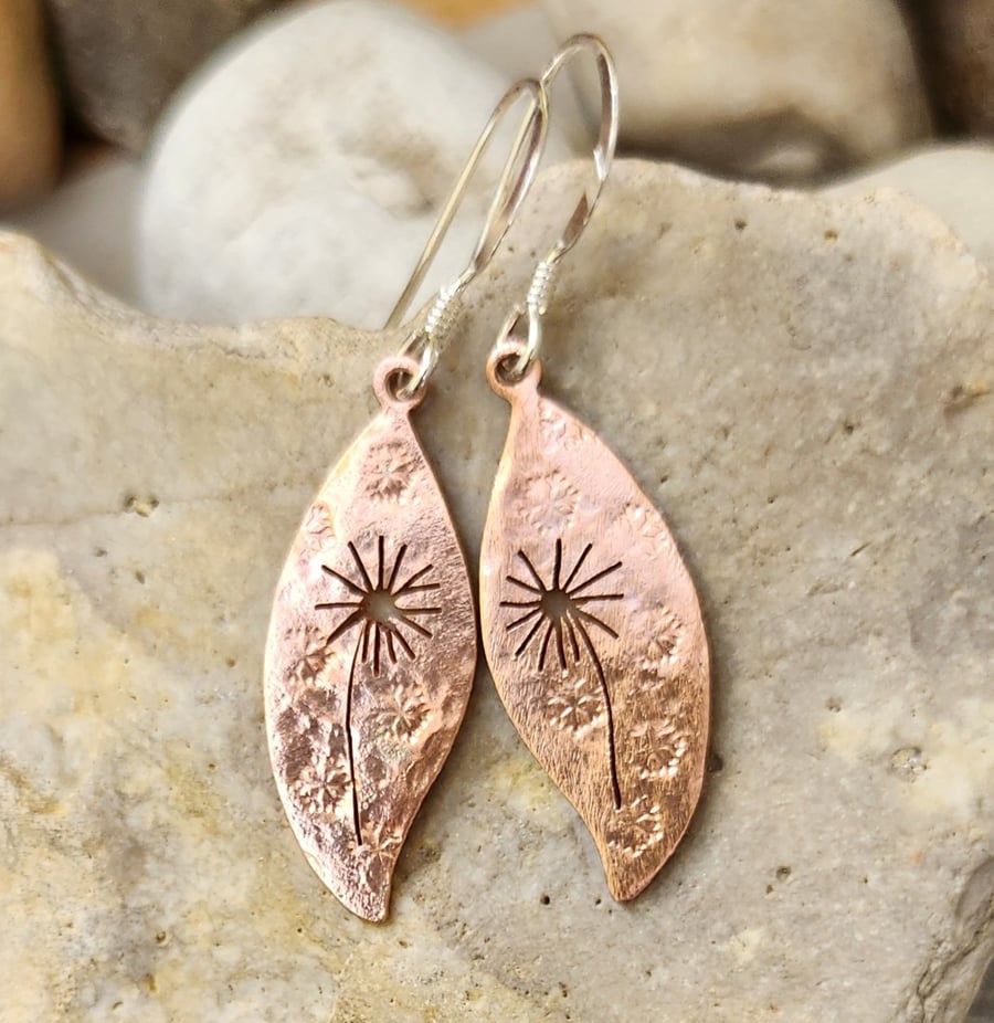 Copper leaf earrings with pierced dandelion clock design