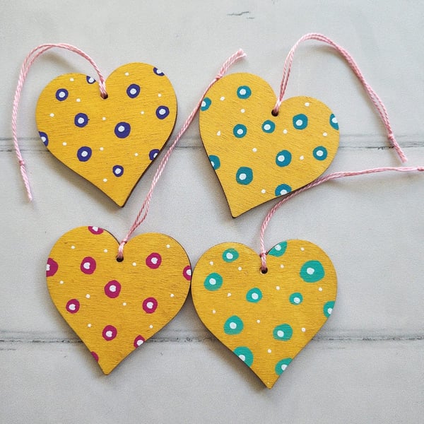Whimsical hand painted gold hearts hanging decoration with polka dots